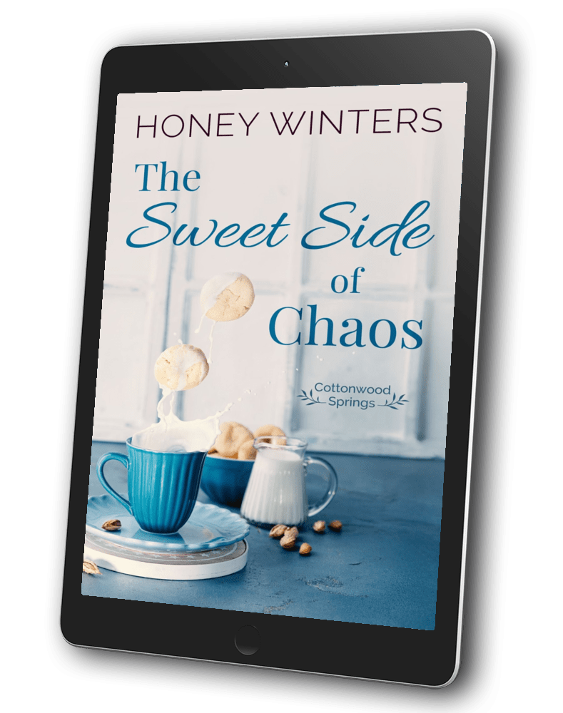 Book cover for The Sweet Side of Chaos by Honey Winters. Two cookies dropping into a cup of milk and splashing.
